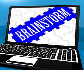 Image showing Brainstorm Puzzle On Notebook Showing Ideas For E-book