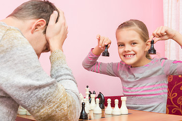 Image showing My daughter is happy that the Pope played two pawns and win in chess