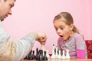 Image showing My daughter was surprised and opened her mouth when dad killed another piece on the chessboard