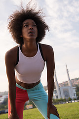 Image showing Portrait of sporty young african american woman running outdoors