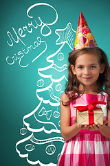 Image showing The cute cheerful little girl on blue background