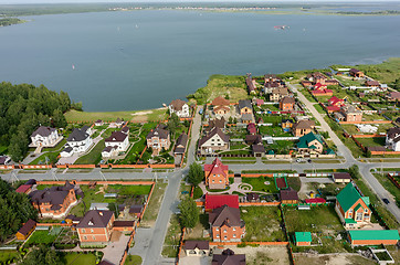 Image showing Aerial view onto private houses on bank of lake