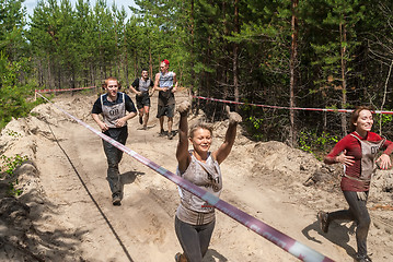 Image showing Women run between stages in extrim race.Tyumen