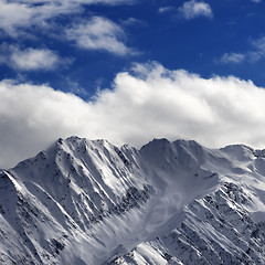 Image showing Snow winter mountains and sunlight cloud sky in evening