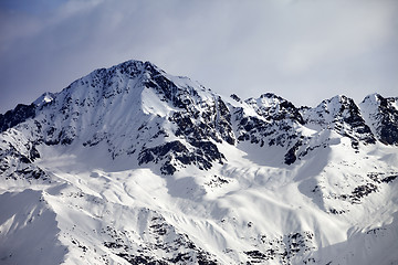 Image showing Snow sunlight mountain and gray sky in evening