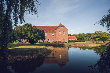 Image showing Red castle near a lake