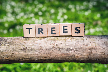 Image showing Wooden log with a tree sign