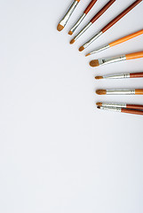 Image showing makeup brush and cosmetics, on a white background