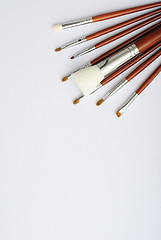 Image showing makeup brush and cosmetics, on a white background