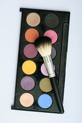 Image showing makeup brush and cosmetics, on a white background