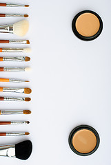 Image showing makeup brush and cosmetics, on a white background