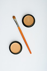 Image showing makeup brush and cosmetics, on a white background