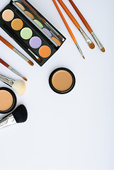 Image showing makeup brush and cosmetics, on a white background