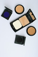 Image showing makeup brush and cosmetics, on a white background