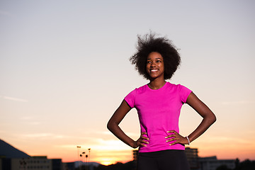 Image showing Portrait of a young african american woman running outdoors