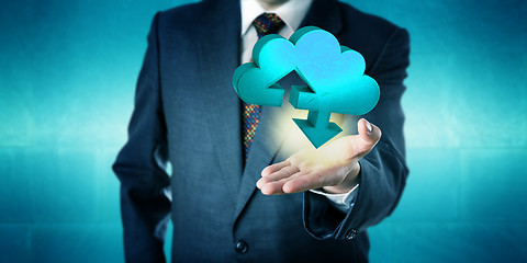 Image showing Businessman Holding A Solid Cloud Transfer Icon