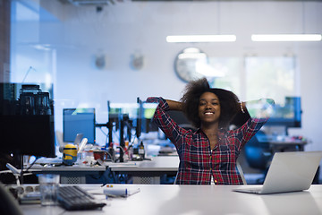 Image showing young black woman at her workplace in modern office  African-Ame