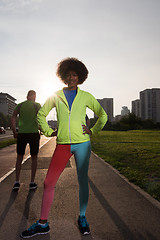 Image showing Portrait of sporty young african american woman running outdoors