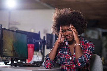Image showing a young African American woman feels tired in the modern office