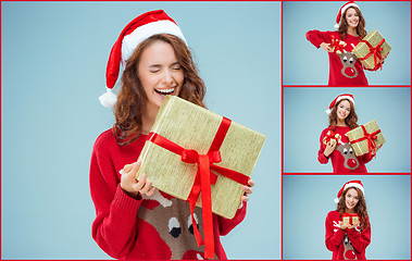 Image showing Girl dressed in santa hat with a Christmas gifts