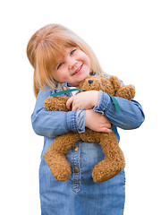 Image showing Cute Little Girl Holding Her Teddy Bear On White