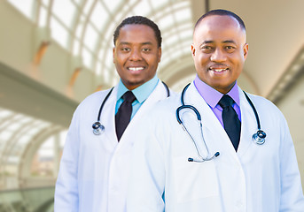 Image showing Two African American Male Doctors Inside Hospital Office