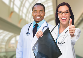 Image showing Female and Male Caucasian and African American Doctors in Hospit