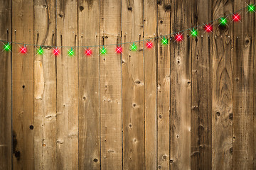 Image showing Lustrous Wooden Background with Green and Red Christmas Lights