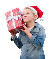 Image showing Young Boy Wearing Santa Hat Holding Christmas Gift