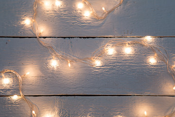 Image showing Christmas festoon on wooden floor