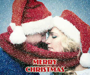 Image showing Lovely christmas couple in Santa Claus hats