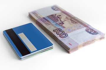 Image showing Bundle of money and bundle of card