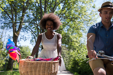 Image showing Young  couple having joyful bike ride in nature