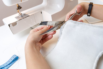 Image showing Sewing machine with woman close-up