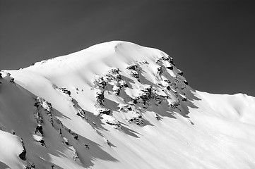 Image showing Black and white view on off-piste slope in winter mountains afte