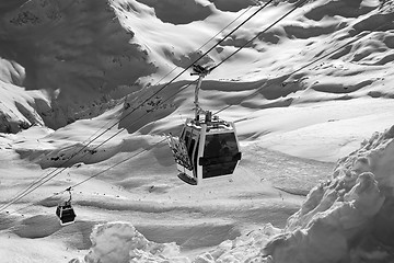 Image showing Black and white view on ski lift in snow mountains