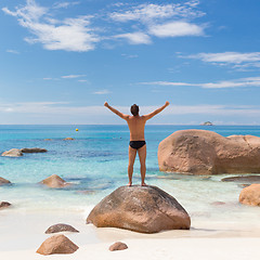 Image showing Woman enjoying Anse Lazio picture perfect beach on Praslin Island, Seychelles.