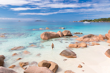 Image showing Woman enjoying Anse Lazio picture perfect beach on Praslin Island, Seychelles.