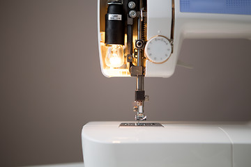 Image showing Sewing machine with open lamp