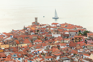 Image showing Rooftops of Piran townwith a bright blue sea in the background, Slovenia.