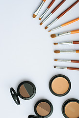 Image showing makeup brush and cosmetics, on a white background