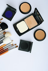 Image showing makeup brush and cosmetics, on a white background