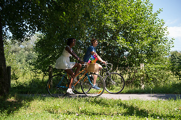 Image showing Young  couple having joyful bike ride in nature