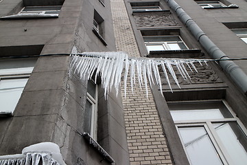 Image showing  large icicles on the wire