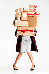 Image showing Gift boxes in the hands of young woman