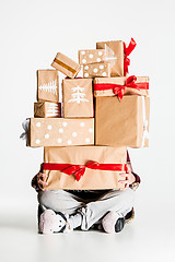 Image showing Gift boxes in the hands of young woman