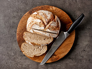 Image showing freshly baked bread and knife