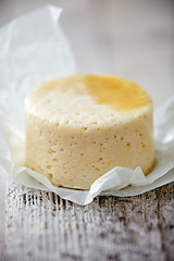 Image showing fresh cheese on wooden table