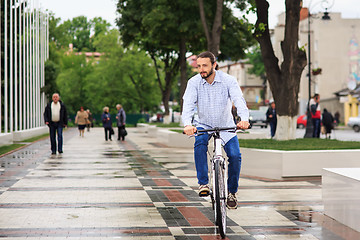 Image showing young hipster man with fixed gear bike on city street