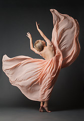 Image showing Woman dancing in light dress